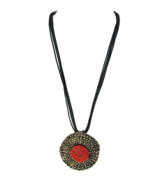 Etched Brass Pendant with Coral Center, Hanging on Black Strands