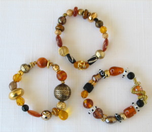 One of a Kind bracelets in topaz, brown black, gold and silver