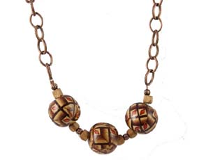 A Chain Necklace with Beige, Brown and Orange Hand Painted Wooden Balls