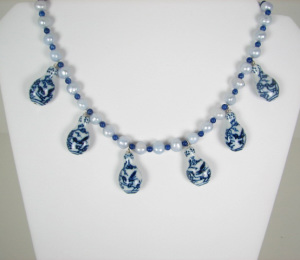 A Necklace of Delft Looking Bottles and Baby Blue Pearls