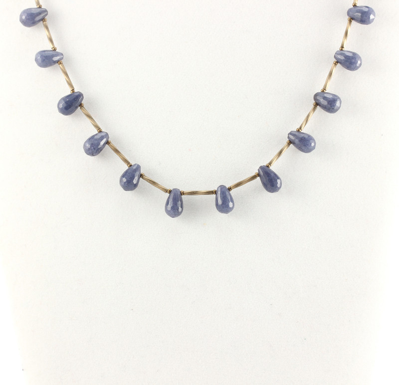 A delicate necklace of blue jade briolettes and Miyuki bronze tubes